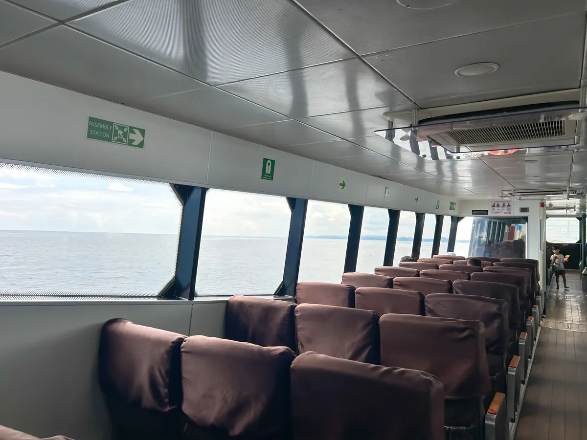 ITT Majestic's massive glass windows offer stunning views throughout the journey Panoramic glass windows inside ITT Majestic ferry showing ocean view