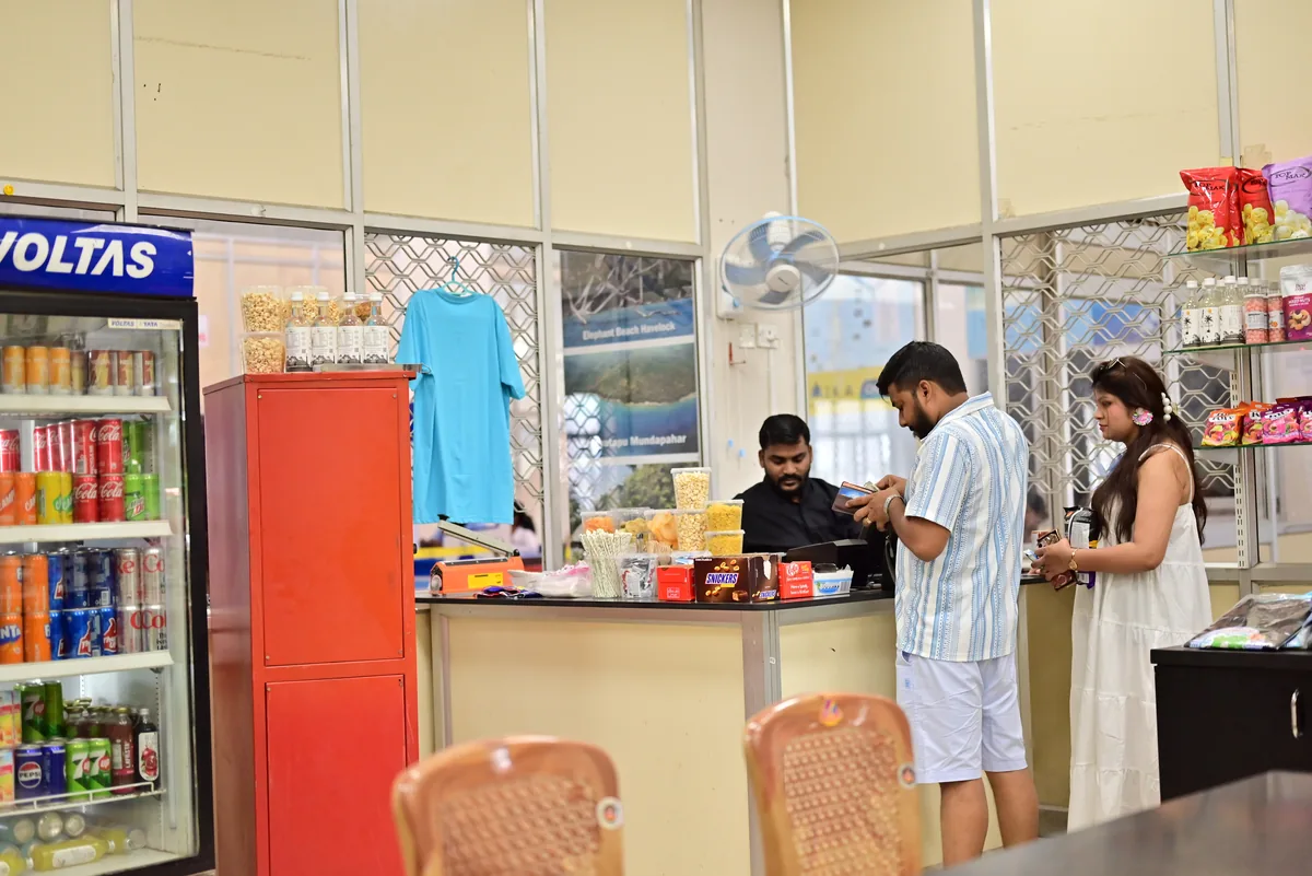 The jetty-side counter — handy for a quick snack before boarding Makruzz jetty-side snack counter selling drinks and packaged snacks before boarding