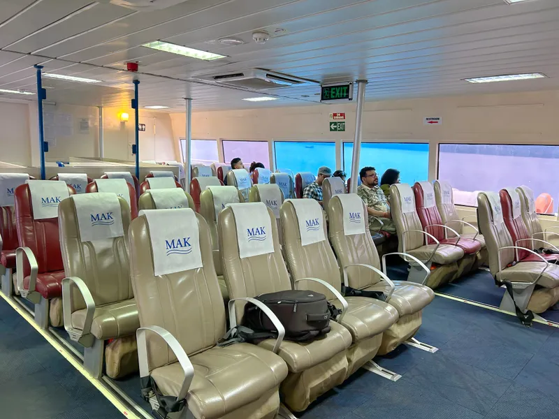 Makruzz deluxe class seating showing wider seats and meal tray