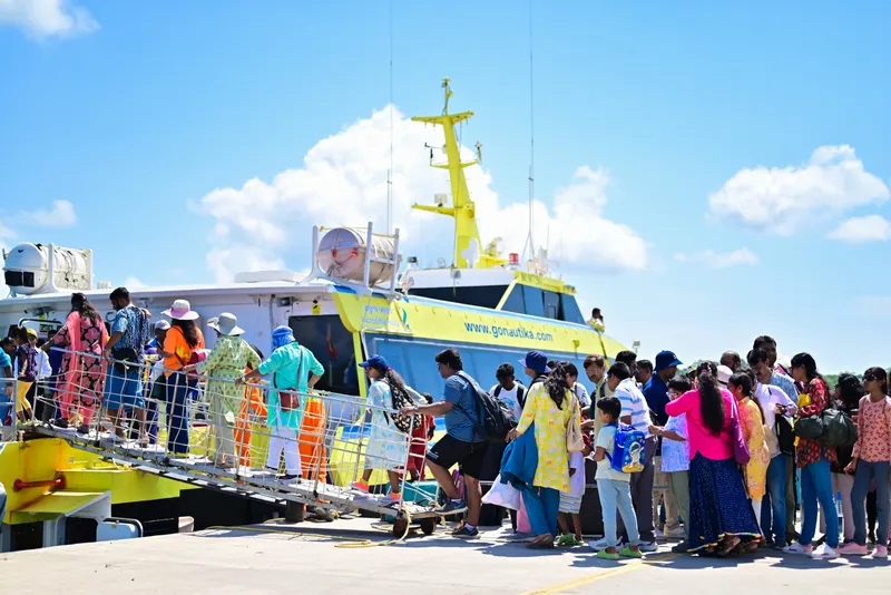 Boarding process – walk via gangway 10-15 minutes before departure Passengers boarding Nautika ferry via gangway at Andaman jetty