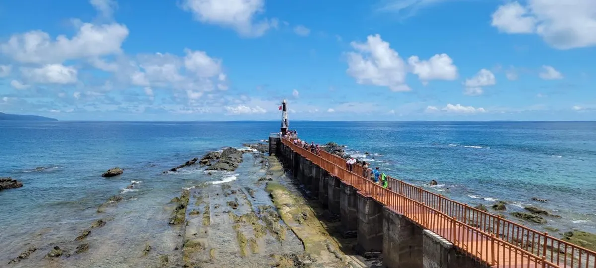 The walkway over the coral flats to the light beacon